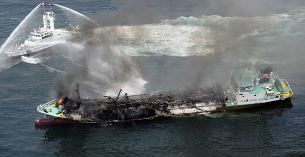 Smoke raises from the fuel tanker Shoko Maru after it exploded off the coast of Himeji, western Japan, in this photo taken by Kyodo