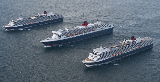 Cunard's magnificent Queens line up three abreast for the first time in dramatic photoshoot as fleet sails from Lisbon to Southampton to mark flagship Queen Mary 2's 10th anniversary
