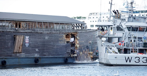 A full-size replica of the Ark of Noah is seen after it crashed into a moored coast guard vessel in Oslo harbour